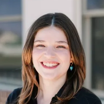 New Patient Advocate Kate Smiling Outdoors