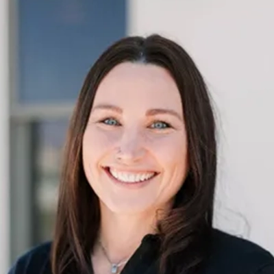 Office Manager Kim Smiling Outside